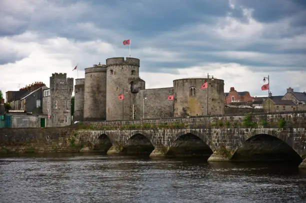 Medieval Ireland. View of King John's Castle and the old medieval quarter of Limerick. King Johnaas Castle is a 13th century Castle on aEKingaas Islandaa in the heart of medieval Limerick City. The Castle overlooks the majestic River Shannon offering wonderful views of Limerick City