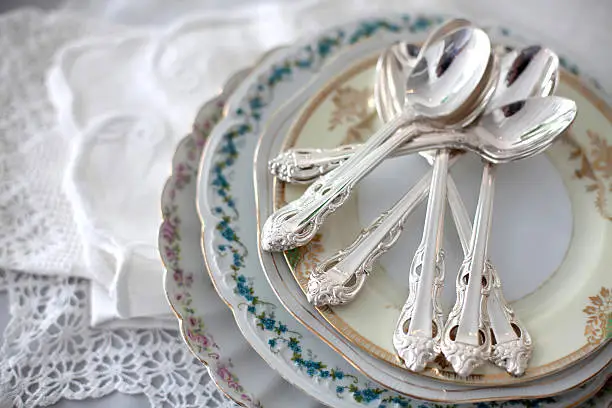 Photo of Vintage plates with silver teaspoons