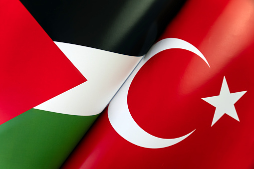 Background of the flags of the Turkey, palestine. The concept of interaction or counteraction between the two countries. International relations. political negotiations. Sports competition.