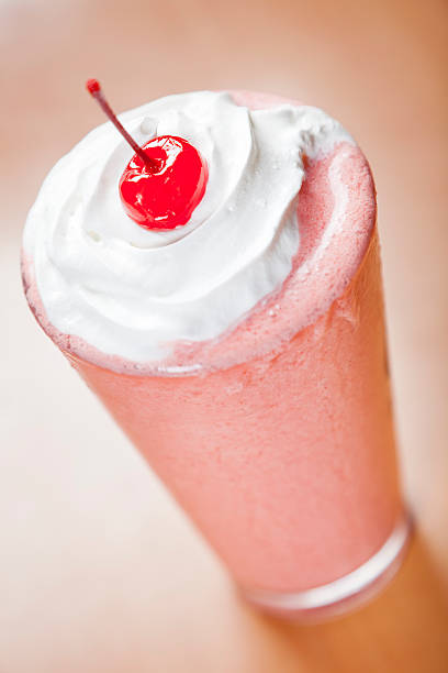 istock Classic glass of strawberry smoothie 184363095