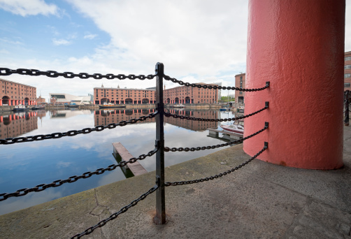 The Albert Dock in Liverpool, England, with the Liverpool Museum in the background.  The dock was opened in 1846 and is a major tourist location, with attractions including the Tate Liverpool, the Merseyside Maritime Museum and the the Beatles Story.