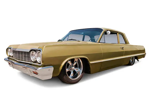 A gold 1964 Chevrolet Impala with chrome wheels.  Vehicle has clipping path, or use as is on white. 