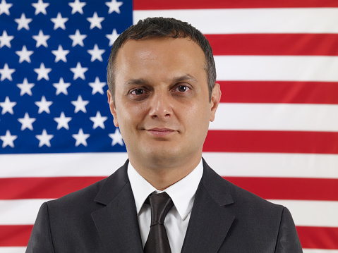 Businessman in front of American flag