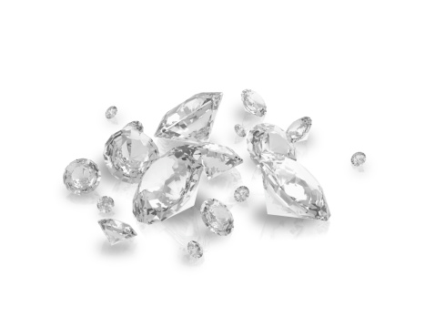 A group of perfect cut brilliant diamonds on a white background.