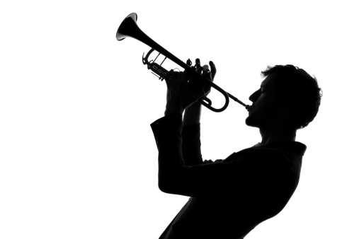 close up. portrait of adult male musician with a trumpet.