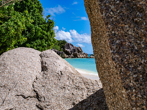 Anse major nature trail, granite rock, silhouette and north island and ocean, Mahe Seychelles