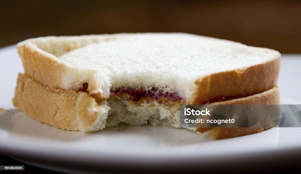 Bite out of a peanut butter sandwich Lunch with shallow depth of view Missing Bite Stock Photo