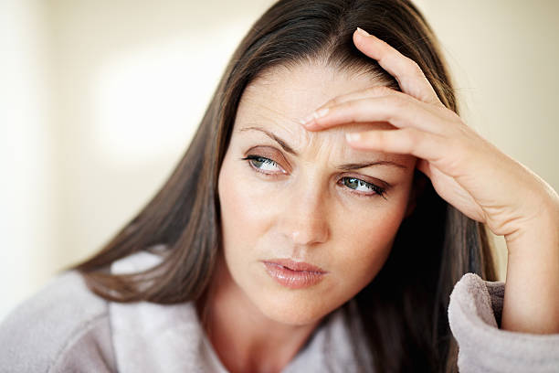 istock Woman with head pain 184364656
