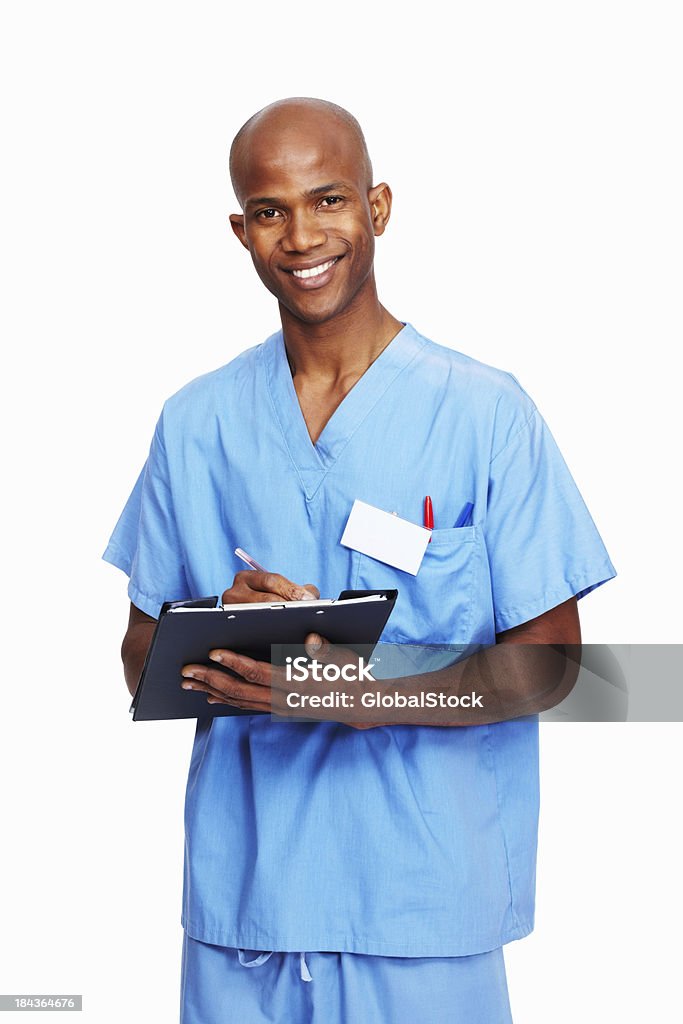 Doctor writing on clipboard - Foto de stock de 30-39 años libre de derechos