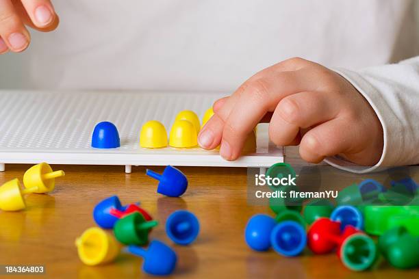 Baby Plays With Toys Stock Photo - Download Image Now - Pegboard, Playing, 12-17 Months