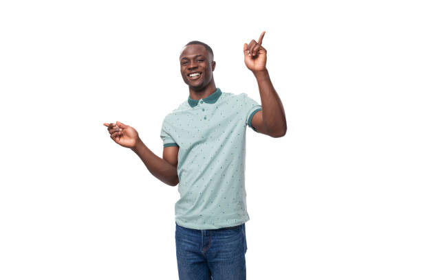 istock young charismatic american guy dressed in a mint t-shirt on a white background 1843648426