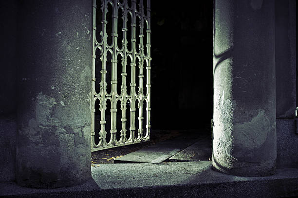istock Old iron gate entrance to church backyard 184365133
