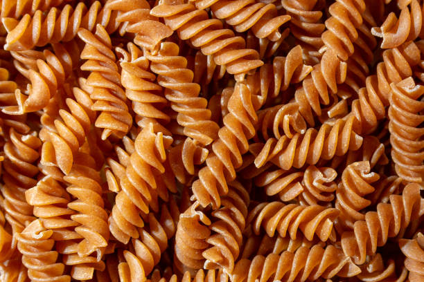 istock Uncooked Whole Grain Fusilli Pasta Background 1843653630