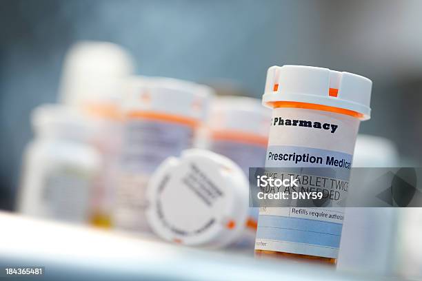 Prescription Drug Bottles Sitting On Countertop Stock Photo - Download Image Now - Prescription Medicine, Bottle, Pill