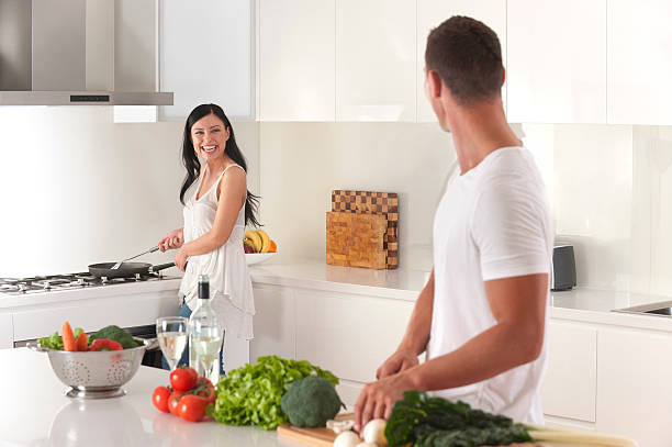 istock Happy young couple cooking 184365626