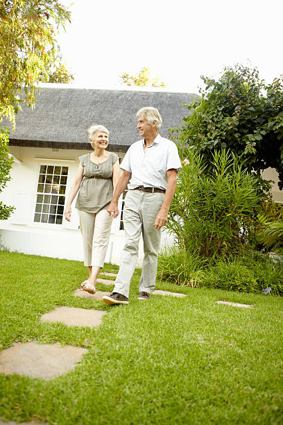 istock Senior couple walking in garden 184366088