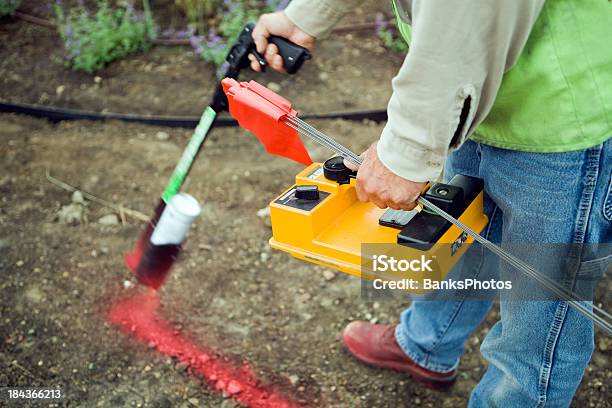 Electric Utility Locator Using Radio Frequency Detector To Mark Line Stock Photo - Download Image Now