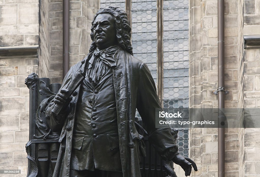 Johann Sebastian Bach Statue "Johann Sebastian Bach Statue in front of St Thomas's Church, Leipzig (Germany). In front of the south portal of St. Thomas's Church in the City of Leipzig stands the 2.45m high statue of Johann Sebastian Bach. Bach was one of the most famous composer, organist, harpsichordist and violist in Germany. Bach lived from 21 March 1685 until 28 July 1750. In 1723, Bach was appointed Cantor of the Thomasschule at St. Thomas Church in Leipzig, as well as Director of Music in the principal churches in the town. The artist of the sculpture was Carl Seffner (1861- 1932). He created this in 1908." Leipzig - Saxony Stock Photo