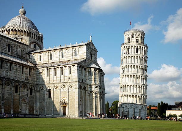 Leaning tower of Pisa "A view of the leaning tower of Pisaand the Duomo, at the Field of Miracles." pisa stock pictures, royalty-free photos & images