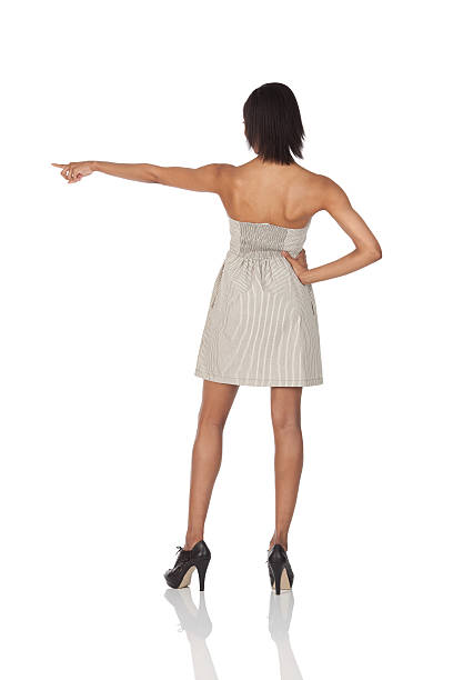 istock Rear view of a woman pointing with finger 184366430