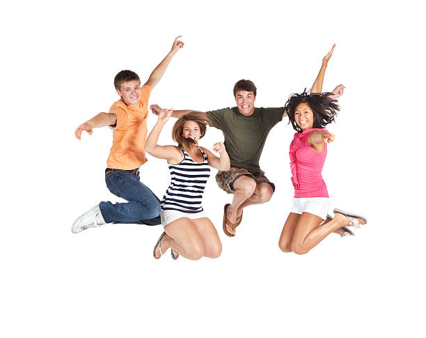 grupo de salto jovem feliz em pose sobre fundo branco - arms outstretched teenage girls jumping flying imagens e fotografias de stock