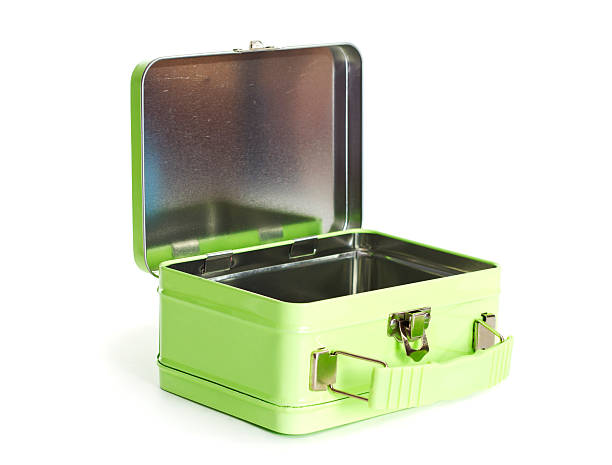 Old green metal lunchbox opened on a white background. An angled shot of an old green lunchbox. lunch box stock pictures, royalty-free photos & images