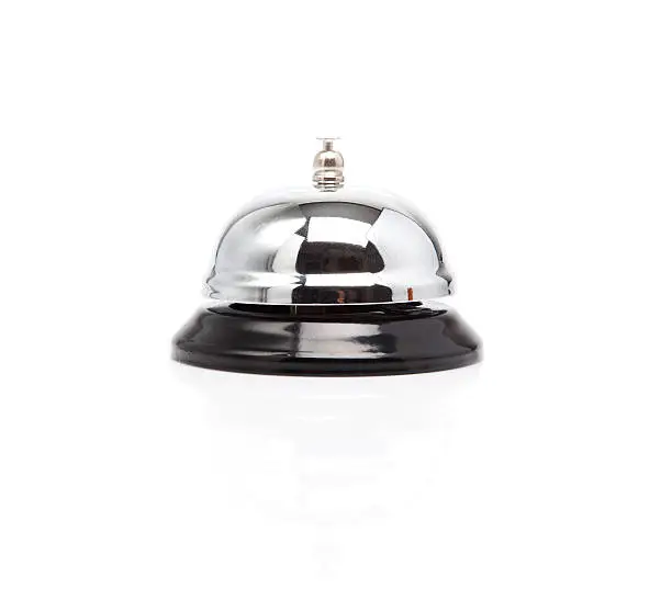 Profile of shiny service bell on white background.
