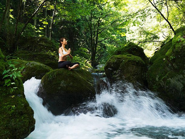 istock Woman doing yoga in nature 184369980