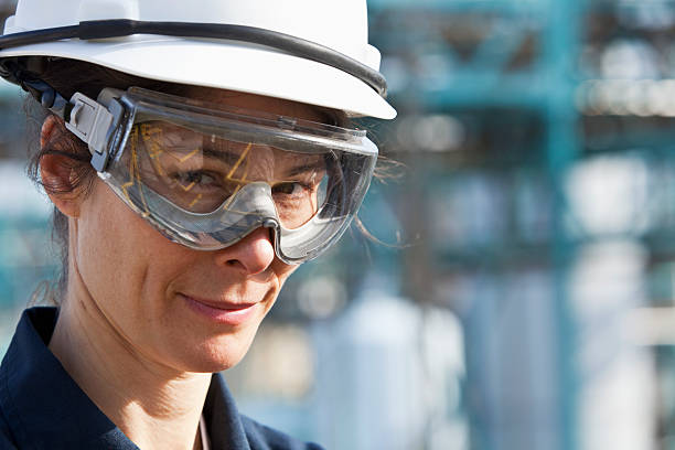 Mid adult woman working in manufacturing plant.
