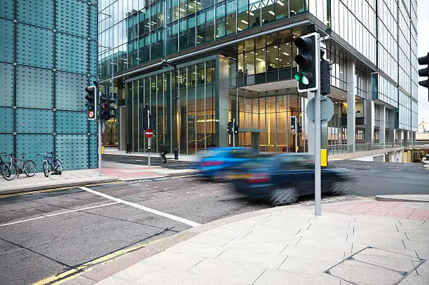 Photo of Cars Driving Through Canary Wharf Financial District of London, England