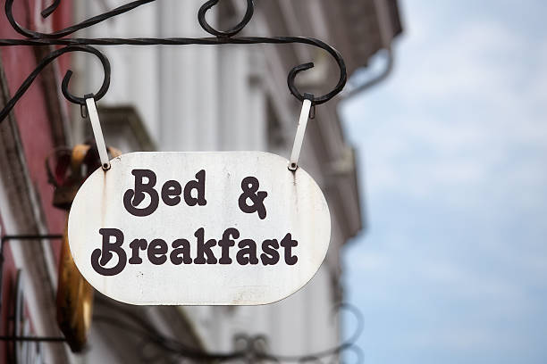 Bed and breakfast Bed and Breakfast sign on building facade. bed and breakfast stock pictures, royalty-free photos & images