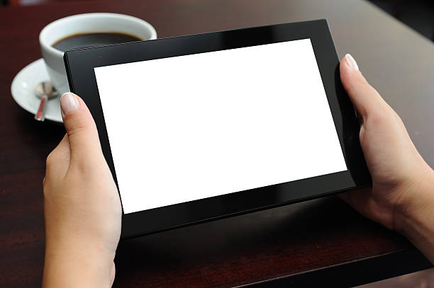 istock Hands holding Digital Tablet in a Coffee Shop 184371082