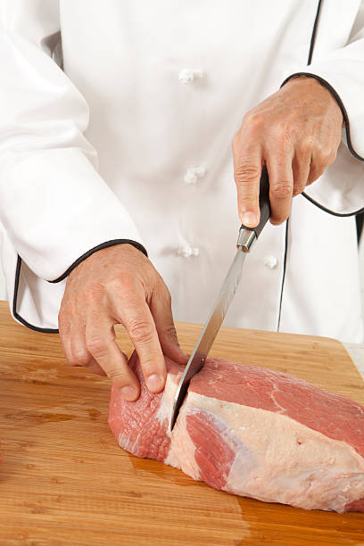 Chef Cutting Meat