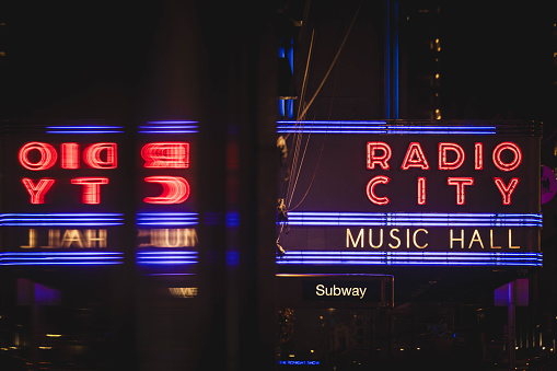 Radio City Music Hall marquee reflection. December 2023. New York City, NY. USA