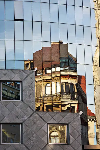Photo of Historic buildings mirrored on Haas Haus in  Stephansplatz. Vienna.