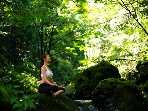 istock Woman doing yoga in nature 184371901
