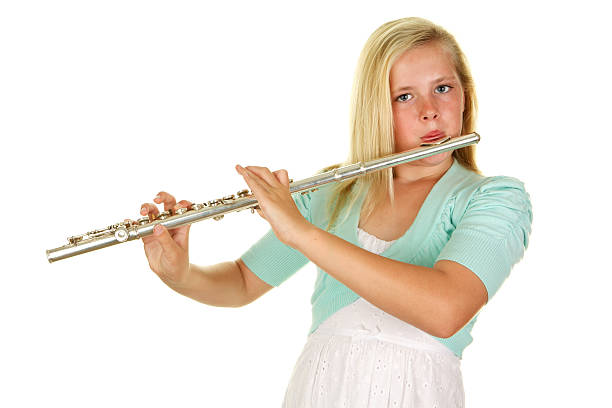 istock Beautiful Eleven Year Old Girl Playing Flute on White Background 184372026