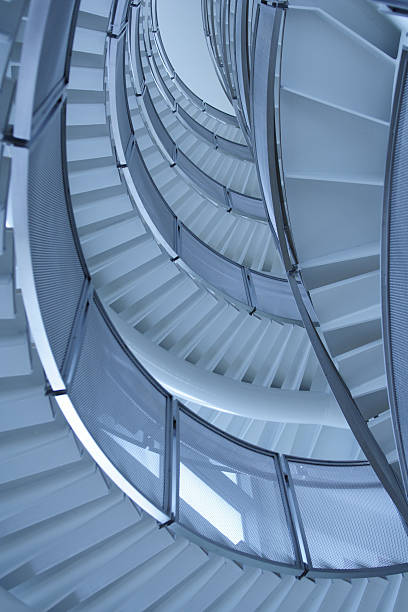 istock Modern double-helix spiral staircase, looking up from below 184372348