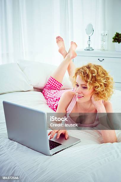 Using Computer In A Bed Stock Photo - Download Image Now - 20-24 Years, 25-29 Years, Adult