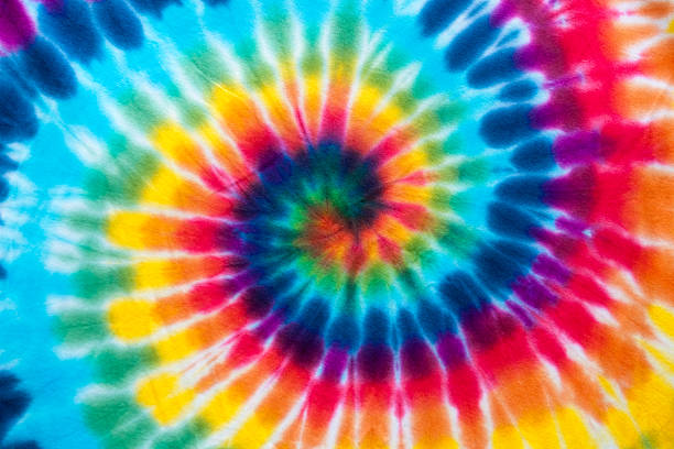 Vibrant Tie Dye Full frame multi coloured tie dyed fabric psychedelic art stock pictures, royalty-free photos & images