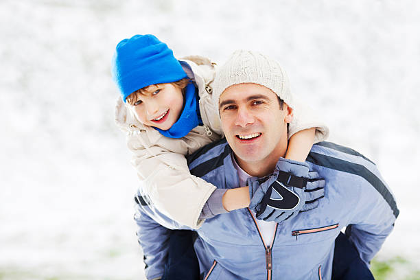 istock Father giving his son a piggyback ride. 184373344