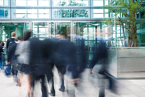 istock Blurred moving business people in a financial district 184374099