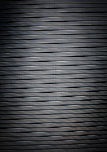 istock dark metal roll door background 184374153