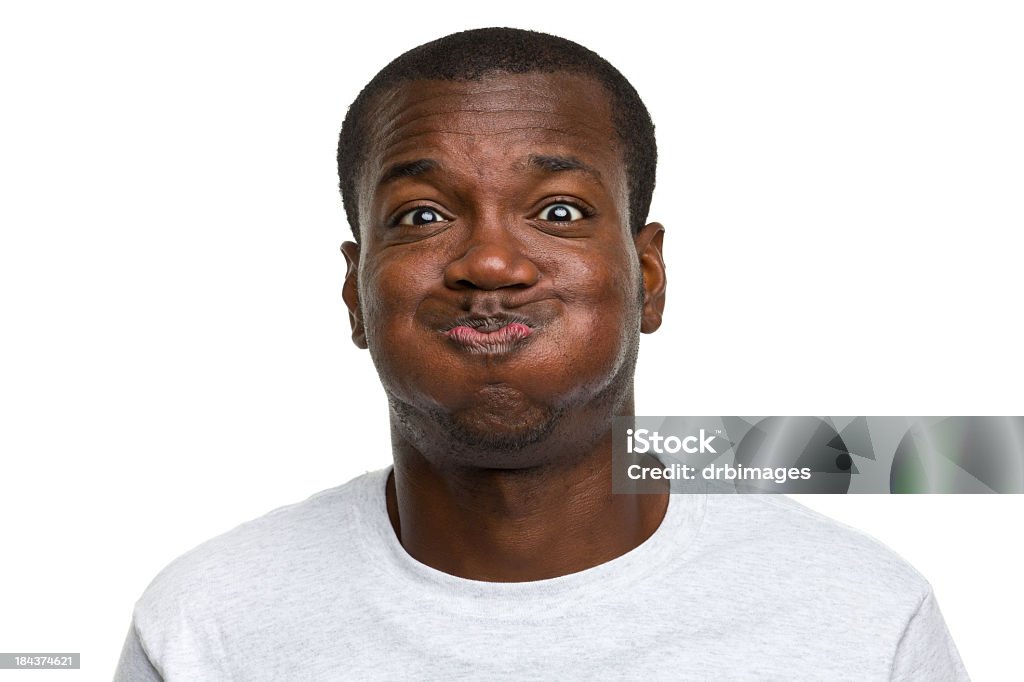 Portrait of young man making a goofy face Portrait of a man on a white background. http://s3.amazonaws.com/drbimages/m/cs.jpg Holding Breath Stock Photo