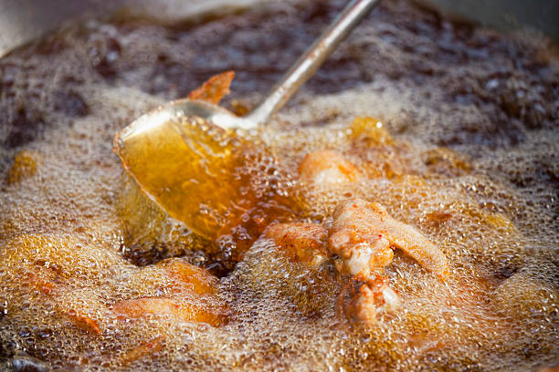 istock Deep frying chicken in a wok. 184375073