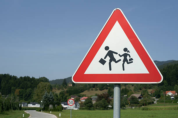 istock School children warning traffic sign 184375079