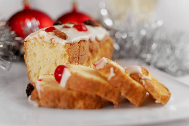 Christmas Stollen with a mixture of nuts, chocolate, sugar and confectionery coating on a white background
