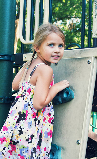 istock Little Girl on Playground Climbing 184375770