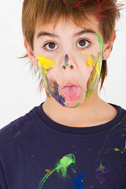 istock Sticking out tongue young artist 184375963