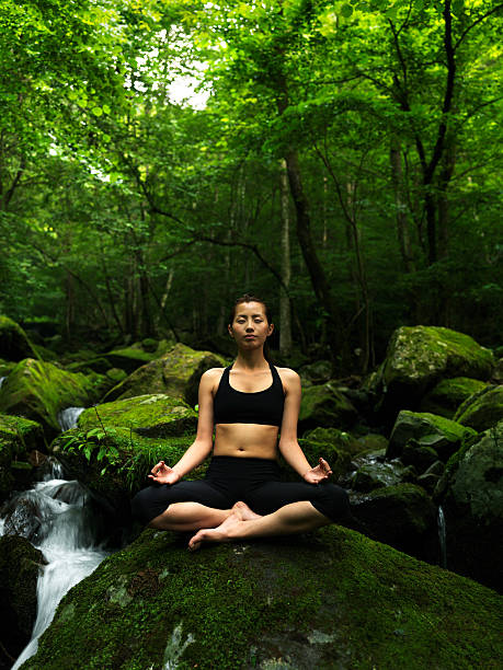 istock Woman doing yoga in nature 184376025